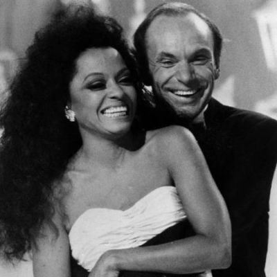 Arne Naess Jr. and Diana Ross hugging each other